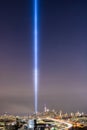 The 9/11 tribute light beams shining high into the sky next to One World Trade