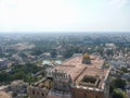 An aerial view of the ancient Rock Fort temple with a cityscape of the town of