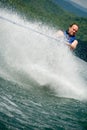 Trick Skier Behind Water Spray Royalty Free Stock Photo