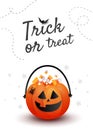 Creative vertical poster with Halloween candy pumpkin bag with decor on orange background with copy space Royalty Free Stock Photo