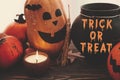 Trick or Treat bloody text, Happy Halloween. Pumpkins, jack-o-lantern, witch cauldron, bats, spider, candle, autumn leaves on