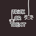 Trick or treat creepy text on dark background poster with spiders.