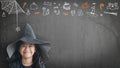 Trick or treat halloween girl kid having fun in witch hat black costume with funny doodle of spider web, jack o lantern and party Royalty Free Stock Photo