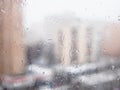 trickles of rain flowing down on window glass