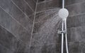 Trickles of water flowing from shower head in bathroom closeup Royalty Free Stock Photo