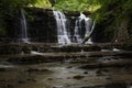 Hidden cascading waterfall in a deep gorge with trickling white water. Forest of Bowland, Ribble Valley, Lancashire Royalty Free Stock Photo