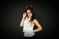 Tricky business lady. Girl red horns celebrate Halloween. Carnival concept. Trick or treat. Halloween costumes. Woman