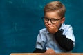 Tricky little boy wearing eyeglasses and shirt Royalty Free Stock Photo