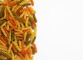 Tricolor, dry and raw pasta Royalty Free Stock Photo