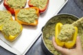 Peppers stuffed with quinoa and avocado pesto