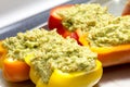 Peppers stuffed with quinoa and avocado pesto