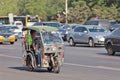 Tricycle motor taxi in busy traffic, Beijing, China