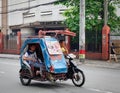 A tricycle running on street in Manila, Philippines
