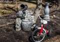 Tricycle, stone jugged water fountain in spring garden Royalty Free Stock Photo