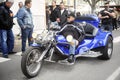 A tricycle to a gathering of American motorcycle