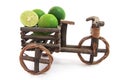 Tricycles with fresh limes on white background Royalty Free Stock Photo