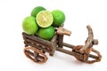 Tricycles with fresh limes on white background Royalty Free Stock Photo