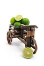 Tricycles with fresh limes on white background