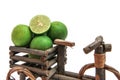 Tricycles with fresh limes on white background