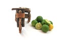Tricycles with fresh limes on white background