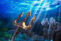 Trident on a dramatic underwater background Royalty Free Stock Photo