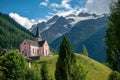 The Trient Eglise Rose church in the Swiss Alps with a green landscape Royalty Free Stock Photo