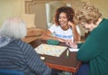 She tries to make a difference every day. a volunteer working with seniors at a retirement home. Royalty Free Stock Photo