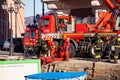 Italian firefighters working for dragging on the pier a shipping container that has fallen into the water, Trieste Royalty Free Stock Photo