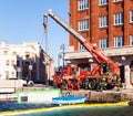 Italian firefighters working for dragging on the pier a shipping container that has fallen into the water, Trieste Royalty Free Stock Photo