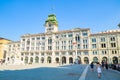 Trieste, Italy - 05.08.2015 : View of Trieste City Hall building in Itally with tourists passing by. Travel destination Royalty Free Stock Photo
