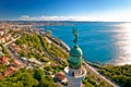 Trieste lighthouse Phare de la Victoire and cityscape panoramic aerial view