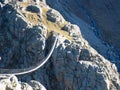 Trift, Switzerland - October 18th 2022: Spectacular rope bridge Triftbruecke crossing a canyon Royalty Free Stock Photo