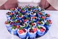 Trifle. A lot of trifles or cake in a blue glasses decorated with berries. Festive layered dessert in glass. Royalty Free Stock Photo