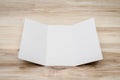 .Trifold white template paper on wood texture