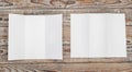 Trifold white template paper on wood texture .