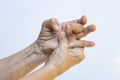 Trigger Finger lock on middle finger, Senior woman right hand massaging her left hand Suffering from pain on white background