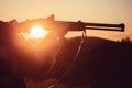 Trigger of the shotgun. Rifle Hunter Silhouetted in Beautiful Sunset. Silhouette of the hunter. Royalty Free Stock Photo