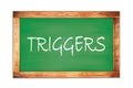 TRIGGERS text written on green school board