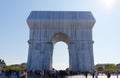 The Triimphal Arch in Paris swathed in silvery blue fabric and red rope as a posthumous project planned by the artist Christo.