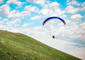 Trike with a parachute against the blue sky. Royalty Free Stock Photo