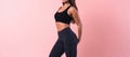 Trim Young Woman In Fitness Clothes On Pink Background With Empty Space, Full Body. Generative AI