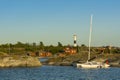 Trimaran moored to cliff HuvudskÃÂ¤r Stockholm achipelago