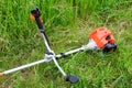 Trimer gascosis with leaf for mowing grass and shrubs Royalty Free Stock Photo