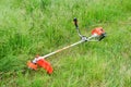 Trimer gascosis with leaf for mowing grass and shrubs Royalty Free Stock Photo