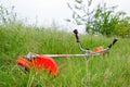 Trimer gascosis with leaf for mowing grass and shrubs Royalty Free Stock Photo