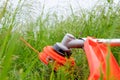 Trimer gascosis with leaf for mowing grass and shrubs Royalty Free Stock Photo