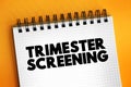 Trimester Screening - test, which helps in early detection of an abnormality in the unborn fetus, text concept on notepad