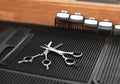 Trimmer attachment and scissors on table in hairdressing salon Royalty Free Stock Photo