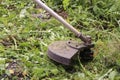 Trimmer close-up mows the grass. Summer garden care concept Royalty Free Stock Photo