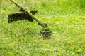 Trimmer head cutting grass to small pieces Royalty Free Stock Photo